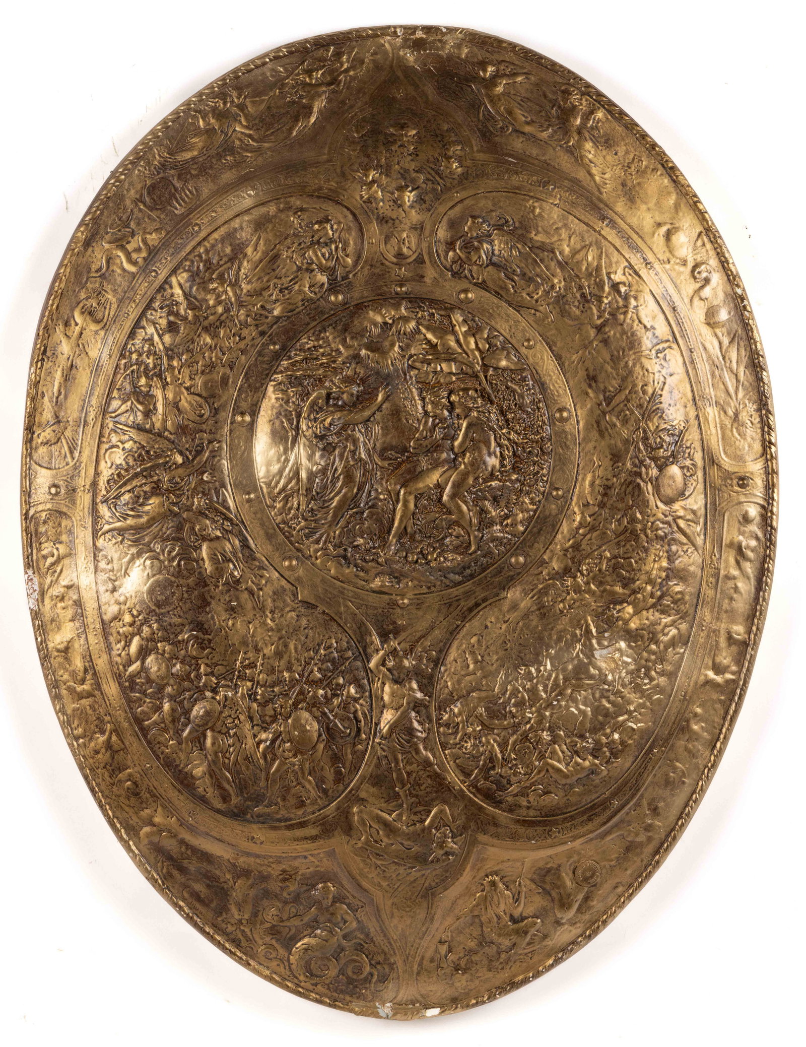 HAROLD STUDIOS, INC MID-CENTURY MODERN SHIELD WALL ART: HAROLD STUDIOS, INC MID-CENTURY MODERN SHIELD WALL ART, fiberglass, featuring an oval shield-like wall hanging decorated with numerous classical figures, angels, and geometric forms. Bears a small rou