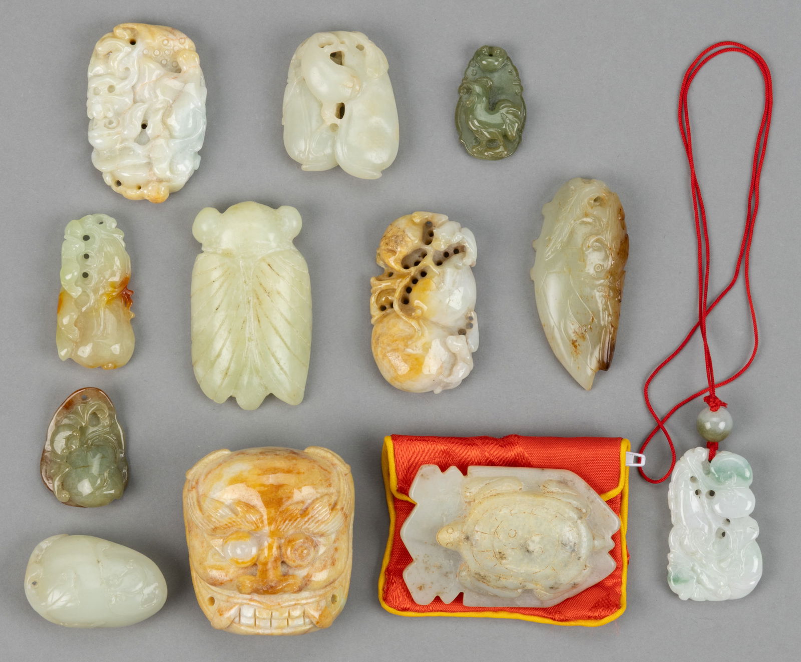 CHINESE / ASIAN CARVED JADE AND OTHER STONE ARTICLES, LOT OF 12: CHINESE / ASIAN CARVED JADE AND OTHER STONE ARTICLES, LOT OF 12, including mostly pendants featuring two of gourds or eggplants with bats, and a figure of a turtle. Most or all 20th century. Turtle pe