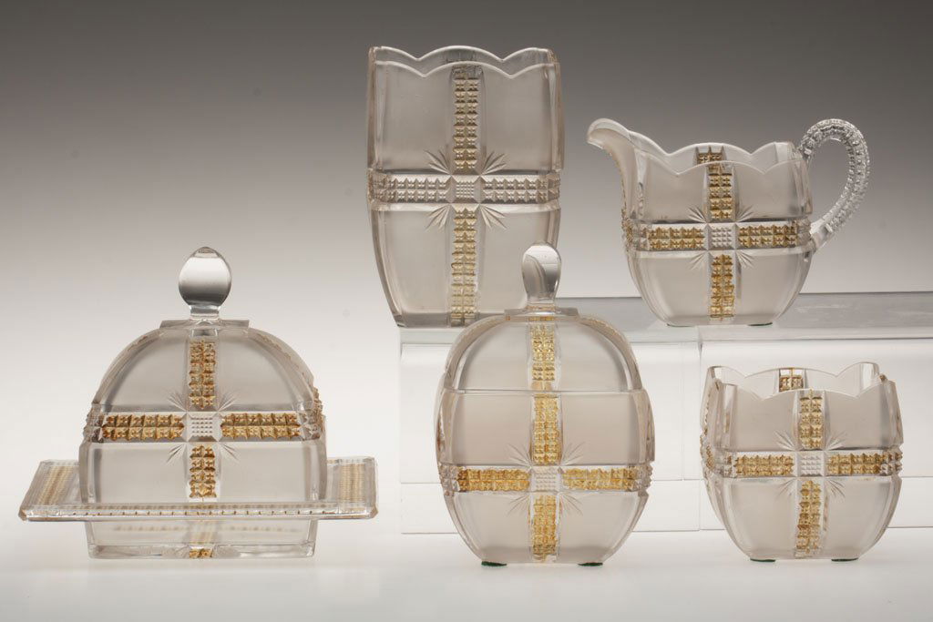 KLONDIKE / AMBERETTE - AMBER STAINED FIVE-PIECE TAB: KLONDIKE / AMBERETTE - AMBER STAINED FIVE-PIECE TABLE SET, colorless with satin panels, comprising a butter dish, celery vase, covered sugar bowl, creamer and a spooner. Dalzell, Gilmore & Leighton Co