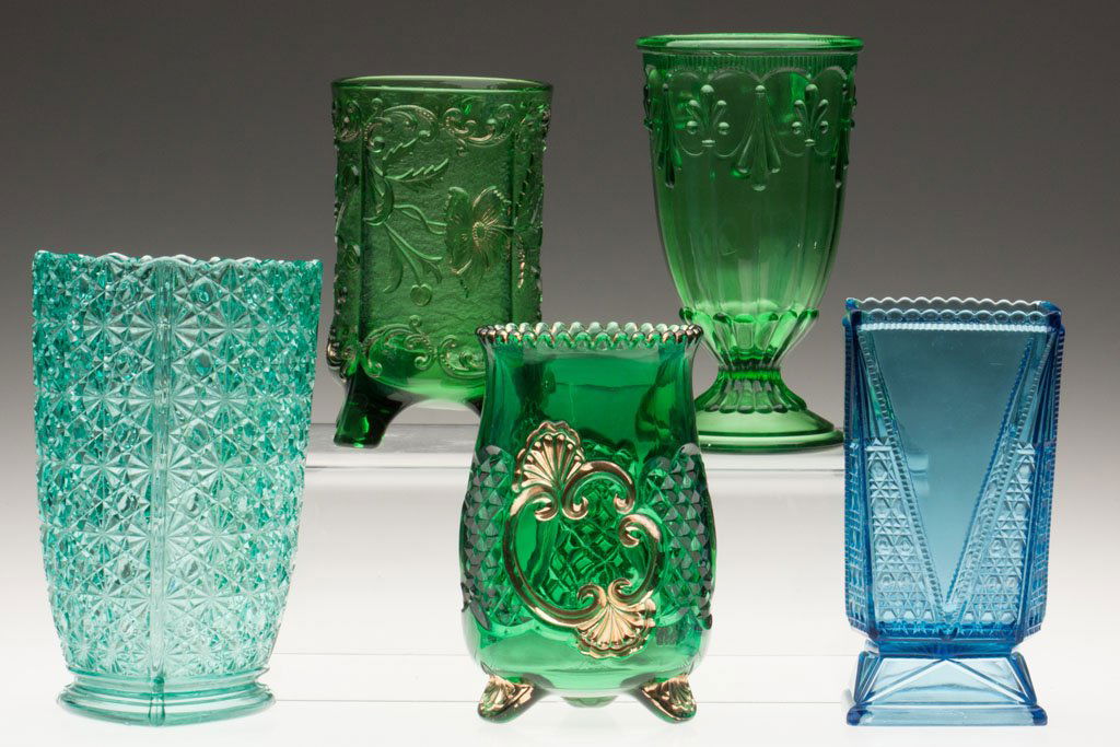 VARIOUS COLORED EAPG CELERY VASES, LOT OF FIVE: VARIOUS COLORED EAPG CELERY VASES, LOT OF FIVE, four green, one blue, two with gilt decoration, including Croesus and Fleur-de-Lys and Drape. Fourth quarter 19th century. 6" to 7 1/2" H. Provenance: T