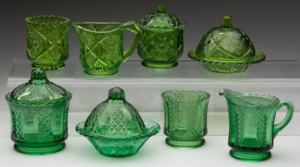 VARIOUS CHILDREN'S GLASS FOUR-PIECE TABLE SETS, LO: VARIOUS CHILDREN'S GLASS FOUR-PIECE TABLE SETS, LOT OF TWO, green, including Cambridge Fernland and Clear and Diamond Panels, each set comprising a covered butter dish, covered sugar bowl, creamer and