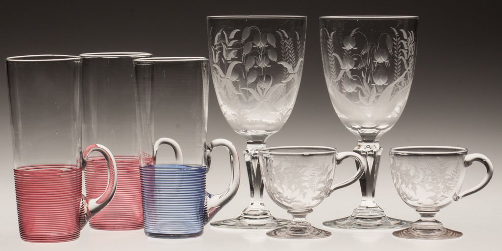 SANDWICH THREADED GLASS HORN GLASSES, LOT OF THREE: SANDWICH THREADED GLASS HORN GLASSES, LOT OF THREE, colorless, two with ruby threading and one with blue threading, each with applied handle and polished pontil mark. Along with two Sandwich custard c