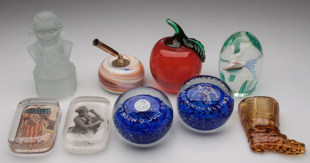 ASSORTED GLASS PAPERWEIGHTS, LOT OF EIGHT: ASSORTED GLASS PAPERWEIGHTS, LOT OF EIGHT, including two signed Gentile Moon Landing commemorative, a Joe Rice apple, a St. Louis World's Fair, and a pen holder combination. Along with a boot novelty 