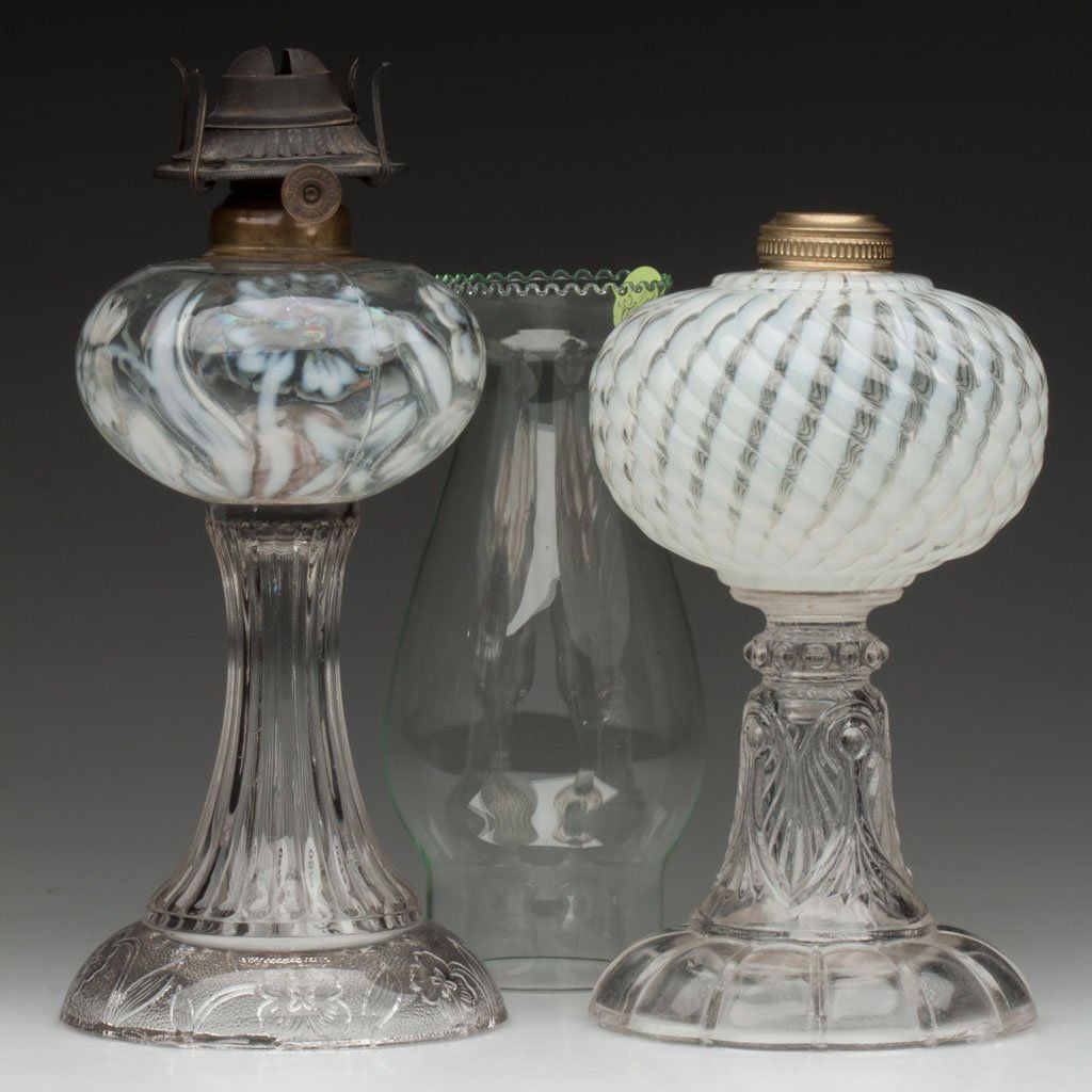 VARIOUS PATTERNED OPALESCENT STAND LAMPS, LOT OF T: VARIOUS PATTERNED OPALESCENT STAND LAMPS, LOT OF TWO, colorless opalescent fonts, colorless bases, comprising a Sheldon Swirl and a Primrose, period Ebling and a Miller oval band collar. One example f