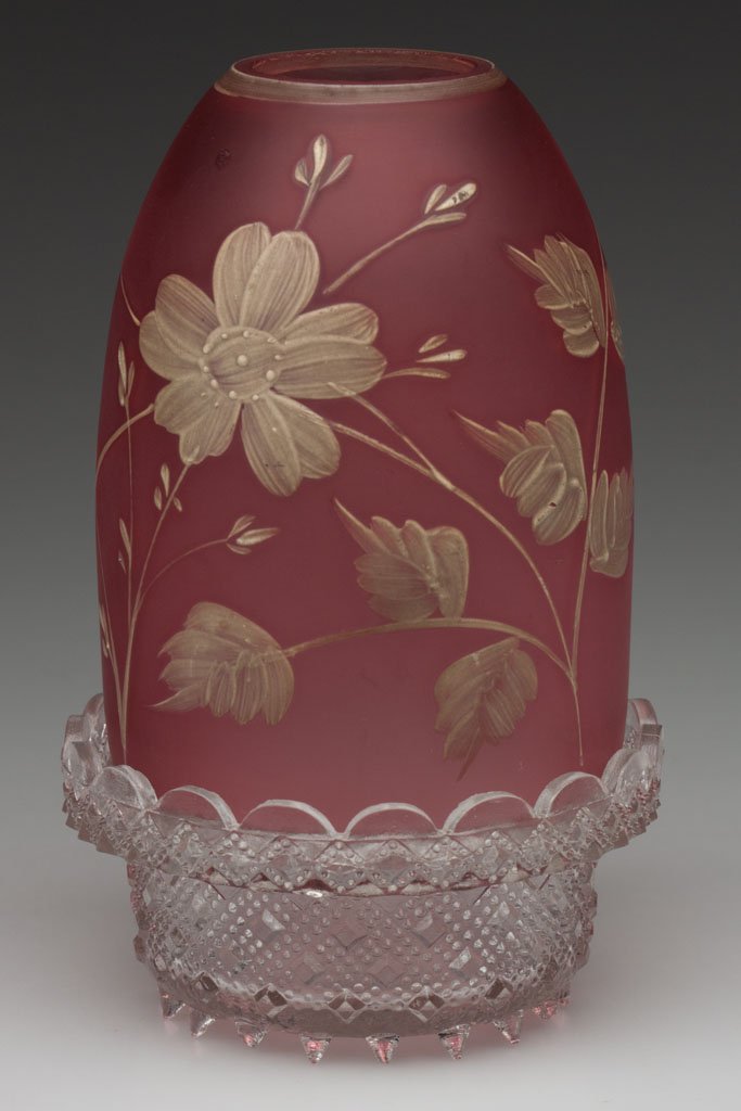 IMPASTO CAMEO FAIRY LAMP: IMPASTO CAMEO FAIRY LAMP, satin ruby/cranberry, off-white enamel floral decoration, unmarked colorless base, lacking candle insert. Probably Phoenix Glass Co. Fourth quarter 19th century. 5 1/2" H, 3 