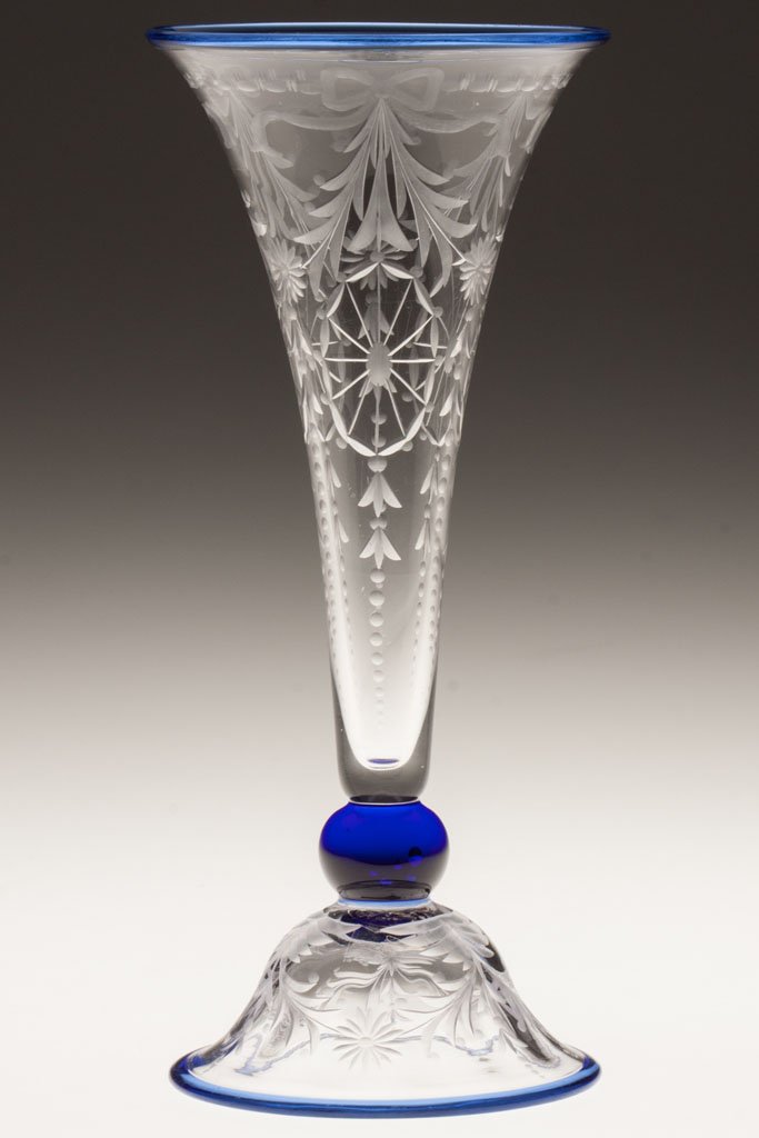 PAIRPOINT WATERFORD PATTERN TRUMPET VASE: PAIRPOINT WATERFORD PATTERN TRUMPET VASE, colorless with applied cobalt blue rims and ball stem, shape F1057. Pairpoint Corporation. Circa 1915-1920. 9 3/4" H. Literature: Parallels Wilson/Spillman - 