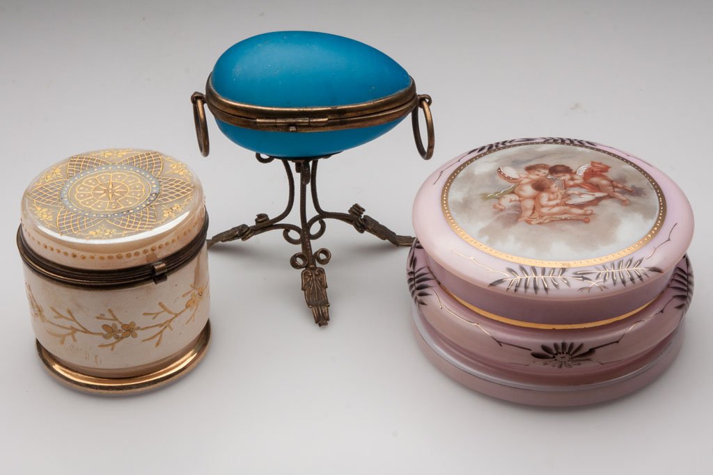 VICTORIAN DRESSER BOXES, LOT OF THREE: VICTORIAN DRESSER BOXES, LOT OF THREE, comprising a blue opaline egg-form with hinged lid and brass mounts, and two decorated opal examples, one with hinged lid. Fourth quarter 19th/early 20th century