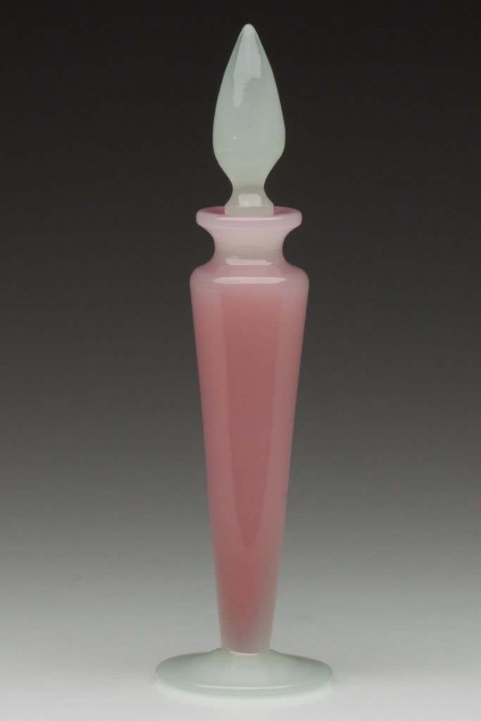 STEUBEN ART GLASS COLOGNE BOTTLE: STEUBEN ART GLASS COLOGNE BOTTLE, Rosaline and Alabaster, tapered form, polished pontil mark, appropriate stopper that sits slightly high, not signed. Steuben Glass Works. First half 20th century. 8"