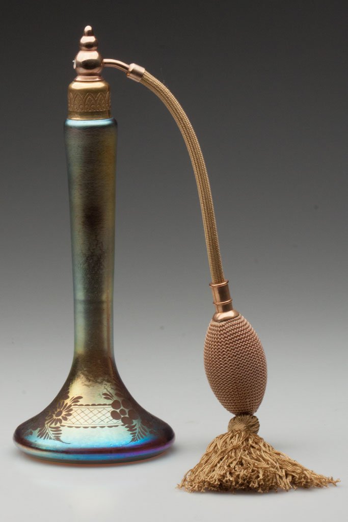 STEUBEN DECORATED AURENE ATOMIZER: STEUBEN DECORATED AURENE ATOMIZER, gold iridescent, shape 6407, with engraved floral decoration around base, polished pontil mark, not signed. Fitted with a later, incorrect top and bulb apparatus. St
