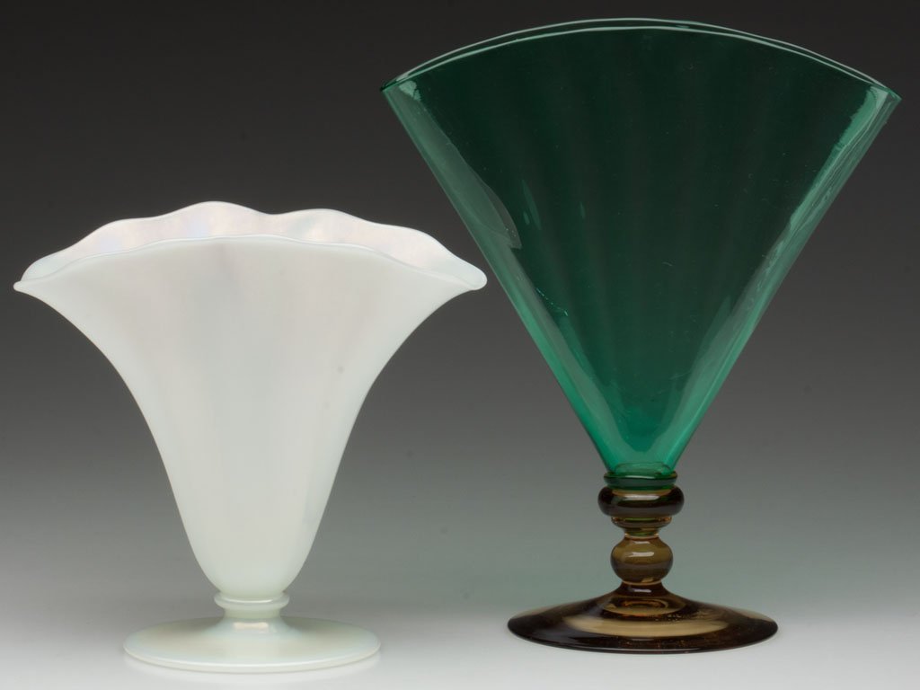 STEUBEN OPTIC VASES, LOT OF TWO: STEUBEN OPTIC VASES, LOT OF TWO, comprising an Ivrene shape 7564 and a Pomona Green and Topaz shape 6287, each with polished pontil mark. Steuben Glass Works. First half 20th century. 5 7/8" and 8 1/2