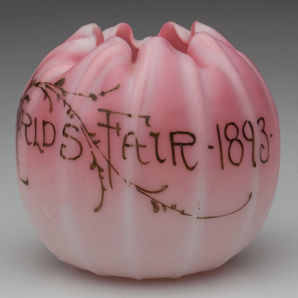 WORLD'S FAIR PEACHBLOW MINIATURE ROSE BOWL: WORLD'S FAIR PEACHBLOW MINIATURE ROSE BOWL, plush finish, 12 ribs and eight-petal rim, "World's Fair / 1893" in gold script, rough pontil mark. Probably Libbey Glass Co./New England Glass Co., or Mt. 