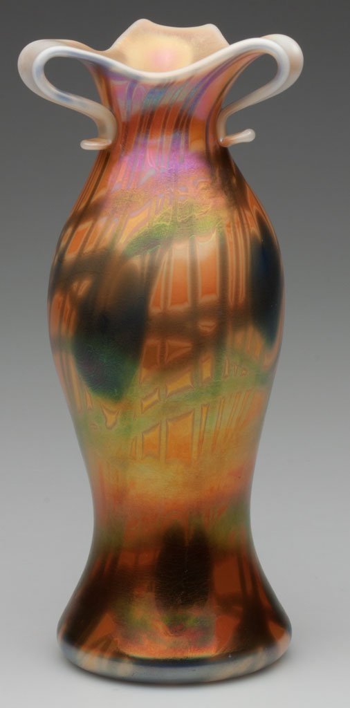 IMPERIAL DECORATED FREE HAND VASE: IMPERIAL DECORATED FREE HAND VASE, iridescent orange with blue hanging hearts, cut and folded out tri-part rim, catalogue number FH 248, polished pontil mark. Imperial Glass Co. Circa 1925. 9 1/2" H. 