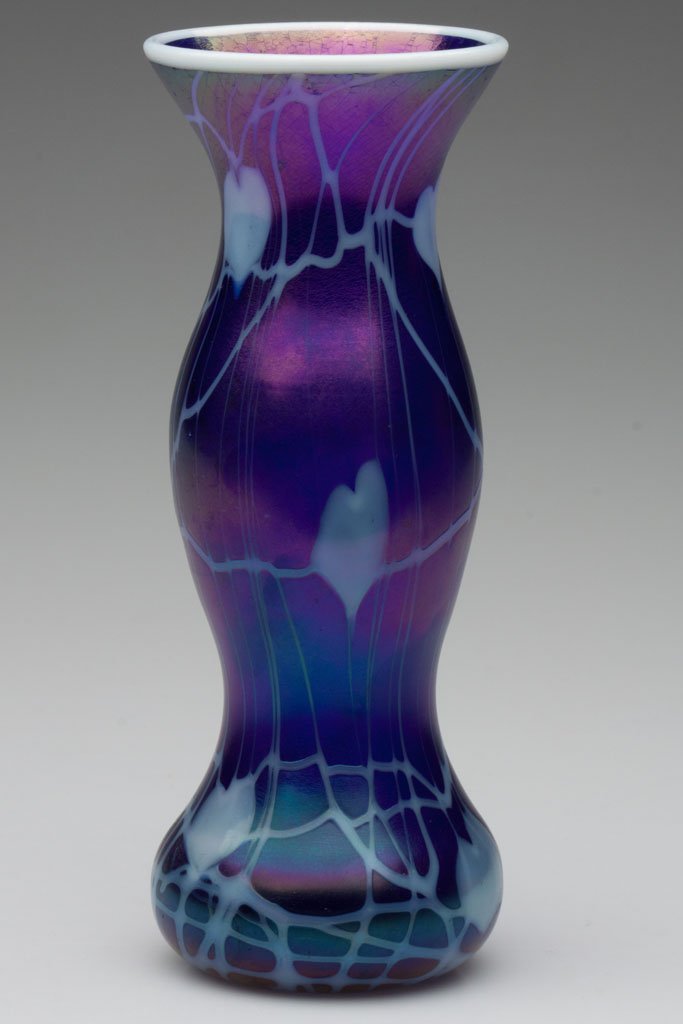 IMPERIAL DECORATED FREE HAND VASE: IMPERIAL DECORATED FREE HAND VASE, iridescent deep cobalt with opal hanging hearts, opal rim, catalogue number FH 306, polished pontil mark with partial original dark green paper label. Imperial Glass