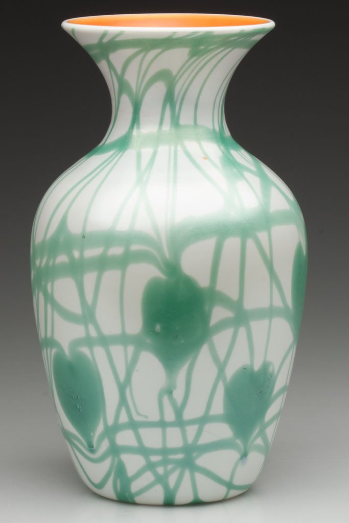 IMPERIAL DECORATED LEAD LUSTRE VASE: IMPERIAL DECORATED LEAD LUSTRE VASE, iridescent white with turquoise hanging hearts, orange interior, shape 417, polished pontil mark. Imperial Glass Co. Circa 1925. 8" H. Literature: Parallels Measel