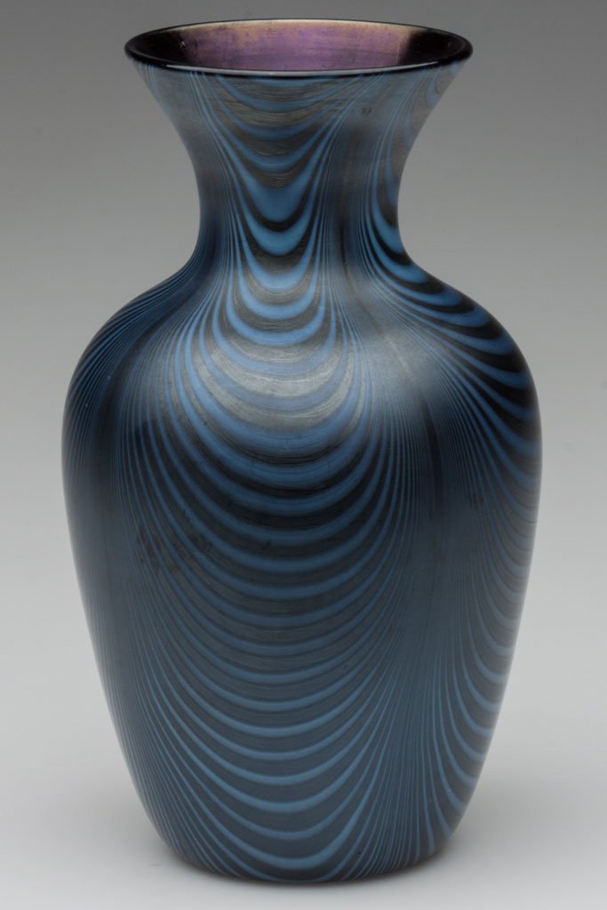 IMPERIAL DECORATED LEAD LUSTRE VASE: IMPERIAL DECORATED LEAD LUSTRE VASE, iridescent deep cobalt with delicate opal drapes, blue interior, shape 618, decoration 12, polished pontil mark. Imperial Glass Co. Circa 1925. 8" H. Literature: M