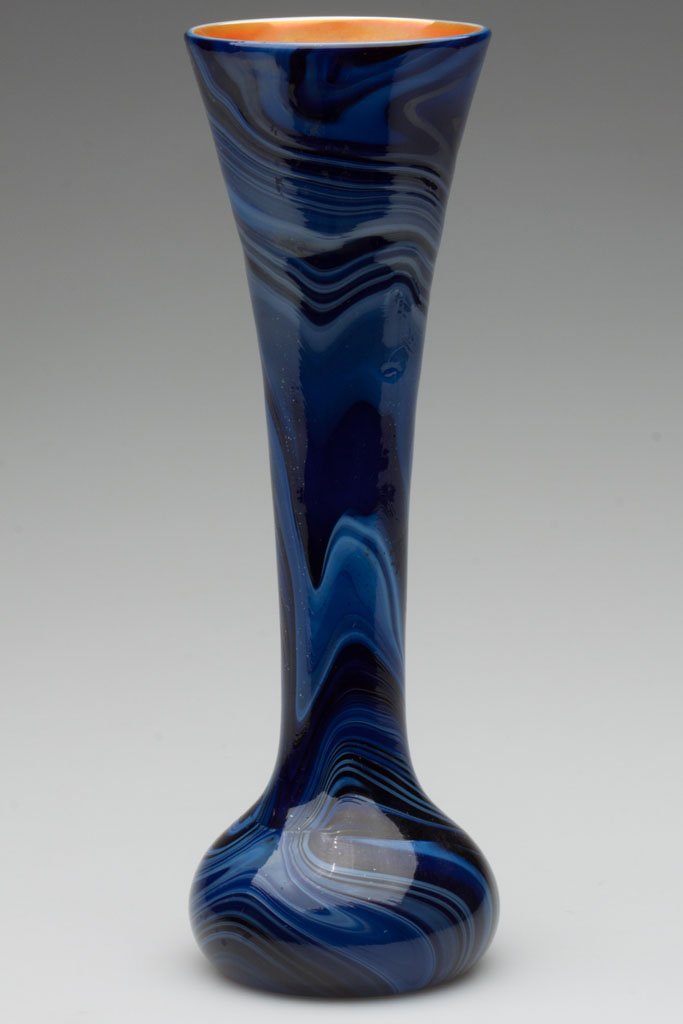 IMPERIAL DECORATED LEAD LUSTRE VASE: IMPERIAL DECORATED LEAD LUSTRE VASE, glossy marbled deep to medium blue, orange interior, shape 623, decoration 21, polished pontil mark. Imperial Glass Co. Circa 1925. 10 1/4" H. Literature: Measell 