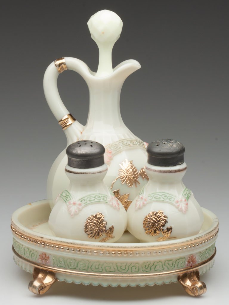 CHRYSANTHEMUM SPRIG / PAGODA (OMN) FOUR-PIECE COND: CHRYSANTHEMUM SPRIG / PAGODA (OMN) FOUR-PIECE CONDIMENT SET, custard with green, pink and gilt decoration, comprising a cruet with correct faceted stopper, a pair of salt and pepper shakers with match