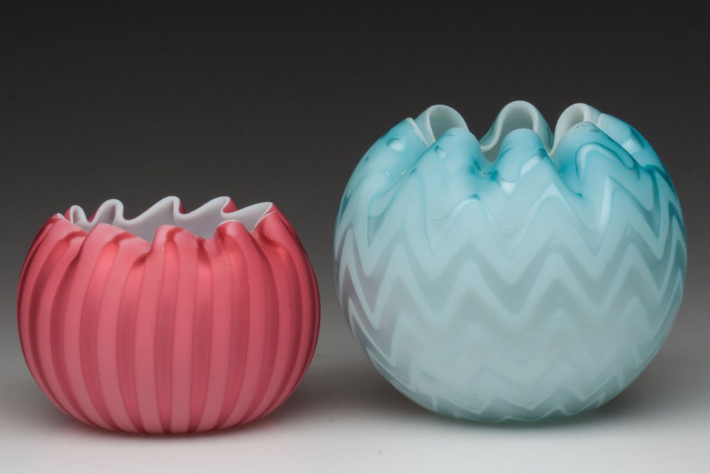 VARIOUS AIR-TRAP MOTHER-OF-PEARL SATIN ROSE BOWLS,: VARIOUS AIR-TRAP MOTHER-OF-PEARL SATIN ROSE BOWLS, LOT OF TWO, comprising a Thomas Webb deep rose stripe example with applied polished pontil disk, and a blue Herringbone/Zig-Zag example with rough po