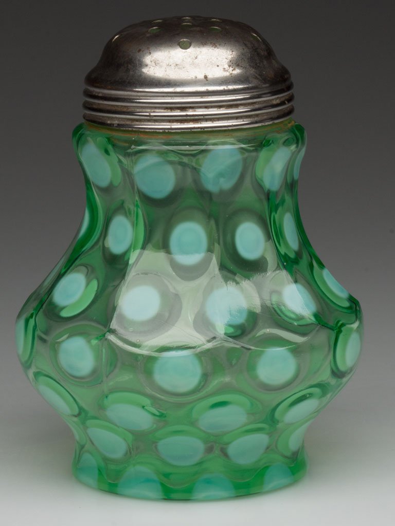 COINSPOT - NINE-PANEL MOLD SUGAR SHAKER: COINSPOT - NINE-PANEL MOLD SUGAR SHAKER, green opalescent, period lid. Late 19th/early 20th century. 4 5/8" HOA. "Provenance: Property of a West Coast collector. Ex-collection of Watt & Janet White. "