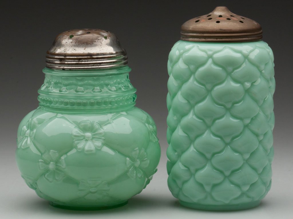 VARIOUS OPAQUE GLASS SUGAR SHAKERS, LOT OF TWO: VARIOUS OPAQUE GLASS SUGAR SHAKERS, LOT OF TWO, opaque green, comprising a Cone and a Quilted Phlox, each with period lid. Late 19th/early 20th century. 4 5/8" and 5 1/4" HOA. Provenance: From the col