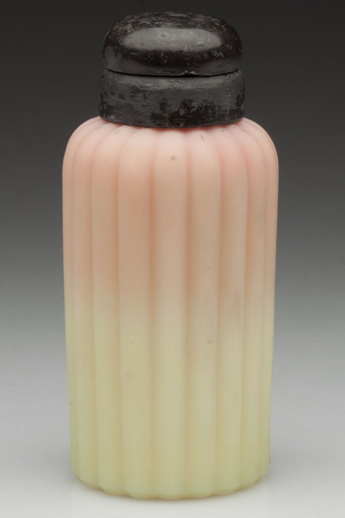 BURMESE RIBBED SALT SHAKER: BURMESE RIBBED SALT SHAKER, satin/plush finish, period two-part silver-plated lid, this example lacking ring at neck. Possibly Mt. Washington Glass Co. Fourth quarter 19th century. 3 5/8" H. Provenanc