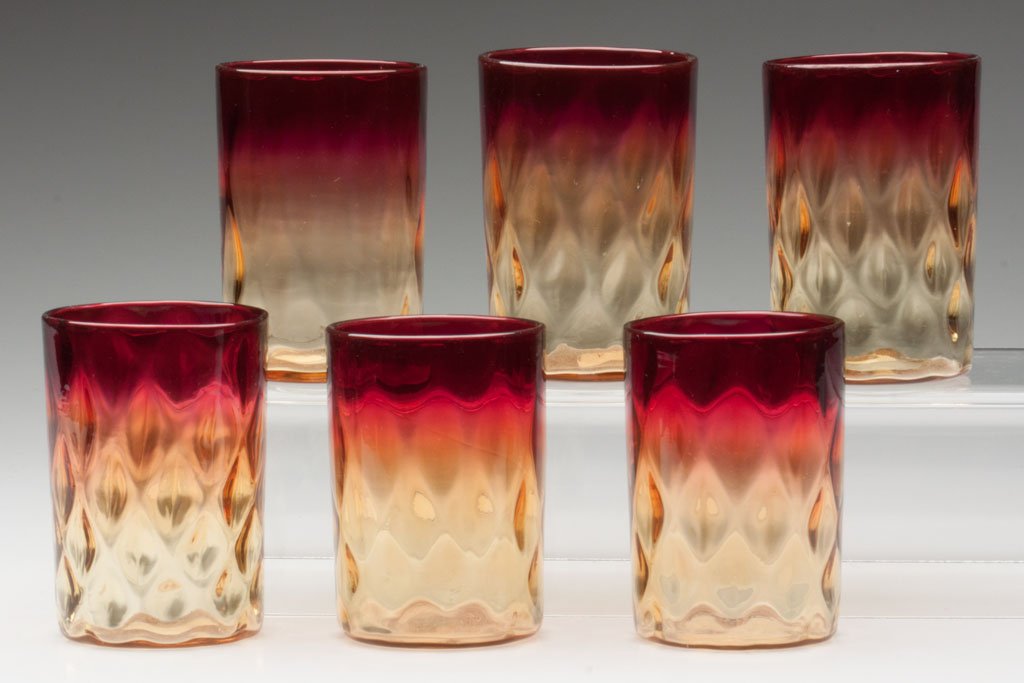 AMBERINA DIAMOND OPTIC TUMBLERS, ASSEMBLED SET OF : AMBERINA DIAMOND OPTIC TUMBLERS, ASSEMBLED SET OF SIX, each with polished pontil mark. Probably New England Glass Co. or Mt. Washington Glass Co. Fourth quarter 19th century. 3 5/8" to 3 3/4" H. Prove