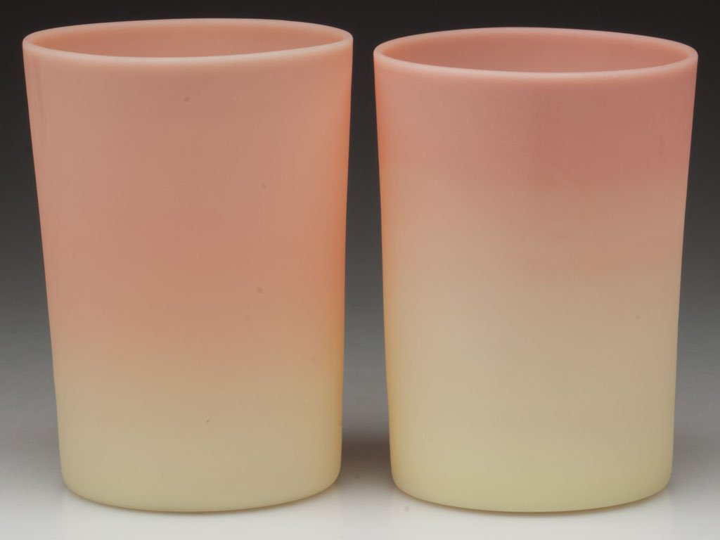 MT. WASHINGTON BURMESE TUMBLERS, LOT OF TWO: MT. WASHINGTON BURMESE TUMBLERS, LOT OF TWO, each with plush finish, polished pontil marks. Mt. Washington Glass Co. 1885-1895. 3 3/4" H. Provenance: Collection of Virginia & Vladimir Weiss, Audubon, 
