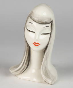 GERMAN W. GOEBEL ART DECO CERAMIC FIGURAL LADY CHARACTERS PERFUME / PORTABLE ELECTRIC LAMP: GERMAN W. GOEBEL ART DECO CERAMIC FIGURAL LADY CHARACTERS PERFUME / PORTABLE ELECTRIC LAMP, depicting a lady with closed eyes and long flowing hair, white ground with charcoal highlights, lips with br