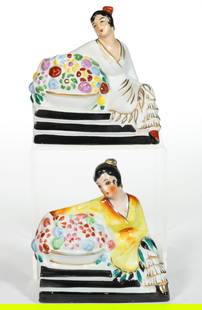 FRENCH HALGA LIMOGES ART DECO CERAMIC FIGURAL LADY PERFUME / PORTABLE ELECTRIC LAMPS, LOT OF TWO: FRENCH HALGA LIMOGES ART DECO CERAMIC FIGURAL LADY PERFUME / PORTABLE ELECTRIC LAMPS, LOT OF TWO, each depicting a Spanish lady sitting at the top of a set of steps with a large floral basket, on