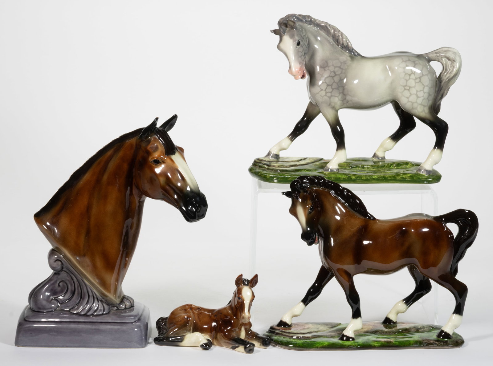 AMERICAN GORT BONE CHINA HAND-PAINTED CERAMIC HORSE FIGURES, LOT OF FOUR: AMERICAN GORT BONE CHINA HAND-PAINTED CERAMIC HORSE FIGURES, LOT OF FOUR, each having polychrome decorations, comprising one dapple grey example standing on a molded ovoid base with grass decorat