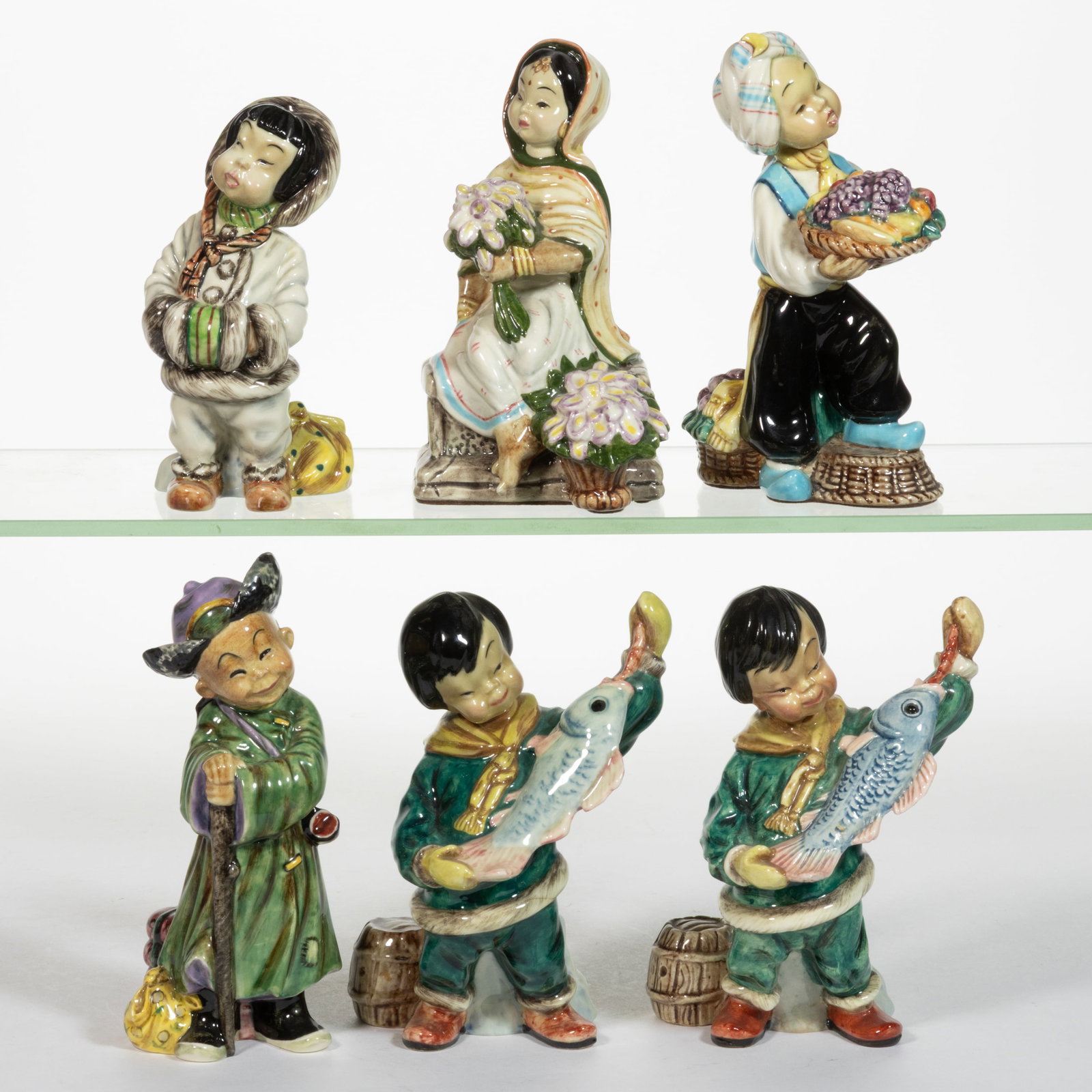 AMERICAN GORT BONE CHINA HAND-PAINTED CERAMIC ASIAN AND INUIT FIGURES, LOT OF SIX: AMERICAN GORT BONE CHINA HAND-PAINTED CERAMIC ASIAN AND INUIT FIGURES, LOT OF SIX, each having polychrome decorations, comprising two titled "NANOOK" depicting a boy holding a large fis