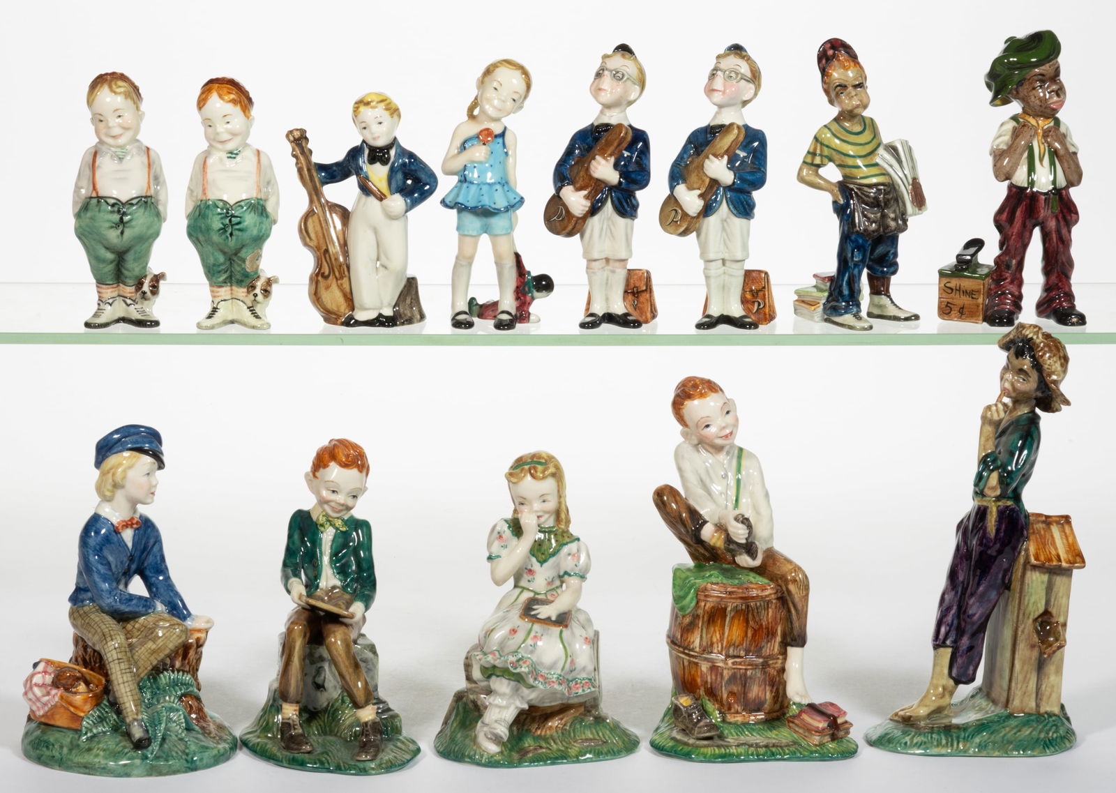 AMERICAN GORT BONE CHINA HAND-PAINTED CERAMIC CHILDREN FIGURES, LOT OF 13: AMERICAN GORT BONE CHINA HAND-PAINTED CERAMIC CHILDREN FIGURES, LOT OF 13, each having polychrome decorations, including youngsters "PERCY" holding a violin case, "BUTCH" with a pu