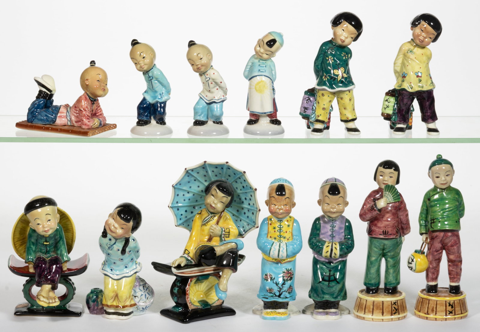 AMERICAN GORT BONE CHINA HAND-PAINTED CERAMIC ASIAN CHILDREN FIGURES, LOT OF 13: AMERICAN GORT BONE CHINA HAND-PAINTED CERAMIC ASIAN CHILDREN FIGURES, LOT OF 13, each having polychrome decorations, including a pair including "LIN" and "JADE" standing on molded