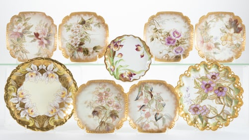 FRENCH LIMOGES PORCELAIN HAND-PAINTED FLORAL MOTIF PLATES, LOT OF NINE