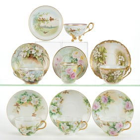 FRENCH LIMOGES PORCELAIN HAND-PAINTED CUP AND SAUCER SETS, LOT OF SEVEN
