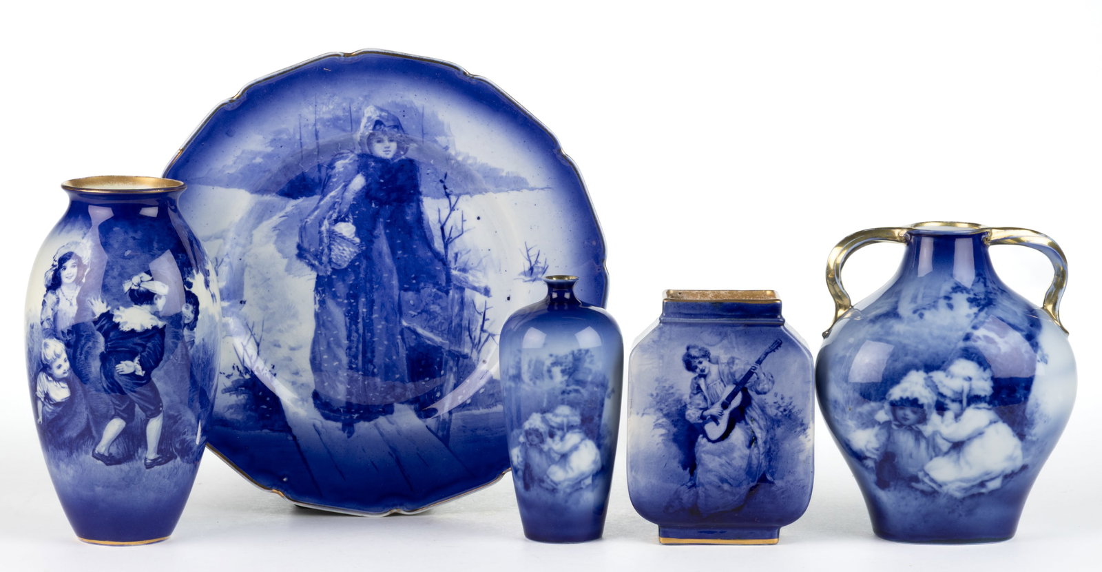 ENGLISH AND GERMAN BLUE AND WHITE FIGURES MOTIF ARTICLES, LOT OF FIVE: ENGLISH AND GERMAN BLUE AND WHITE FIGURES MOTIF ARTICLES, LOT OF FIVE, comprising a 10 1/2" D plate depicting a woman in winter clothing, standing on a bridge in snow and four vases includin