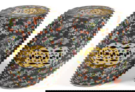 PAIR OF CHINESE EXPORT FAMILLE NOIRE PORCELAIN GARDEN SEATS: PAIR OF CHINESE EXPORT FAMILLE NOIRE PORCELAIN GARDEN SEATS, each of barrel form with molded stud bands above and below, featuring floral designs with birds and pierced cash symbols. 20th century