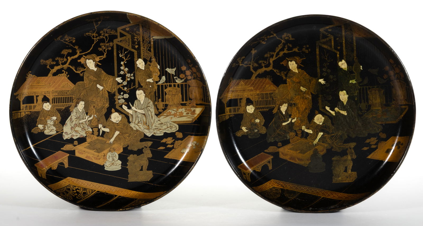 PAIR OF CHINESE LACQUERED PAPIER-MACHE DISHES: PAIR OF CHINESE LACQUERED PAPIER-MACHE DISHES, both depicting the same scene of people who appear to be making some form of sculptures / figures, one man in the center appears to be cutting gold leaf