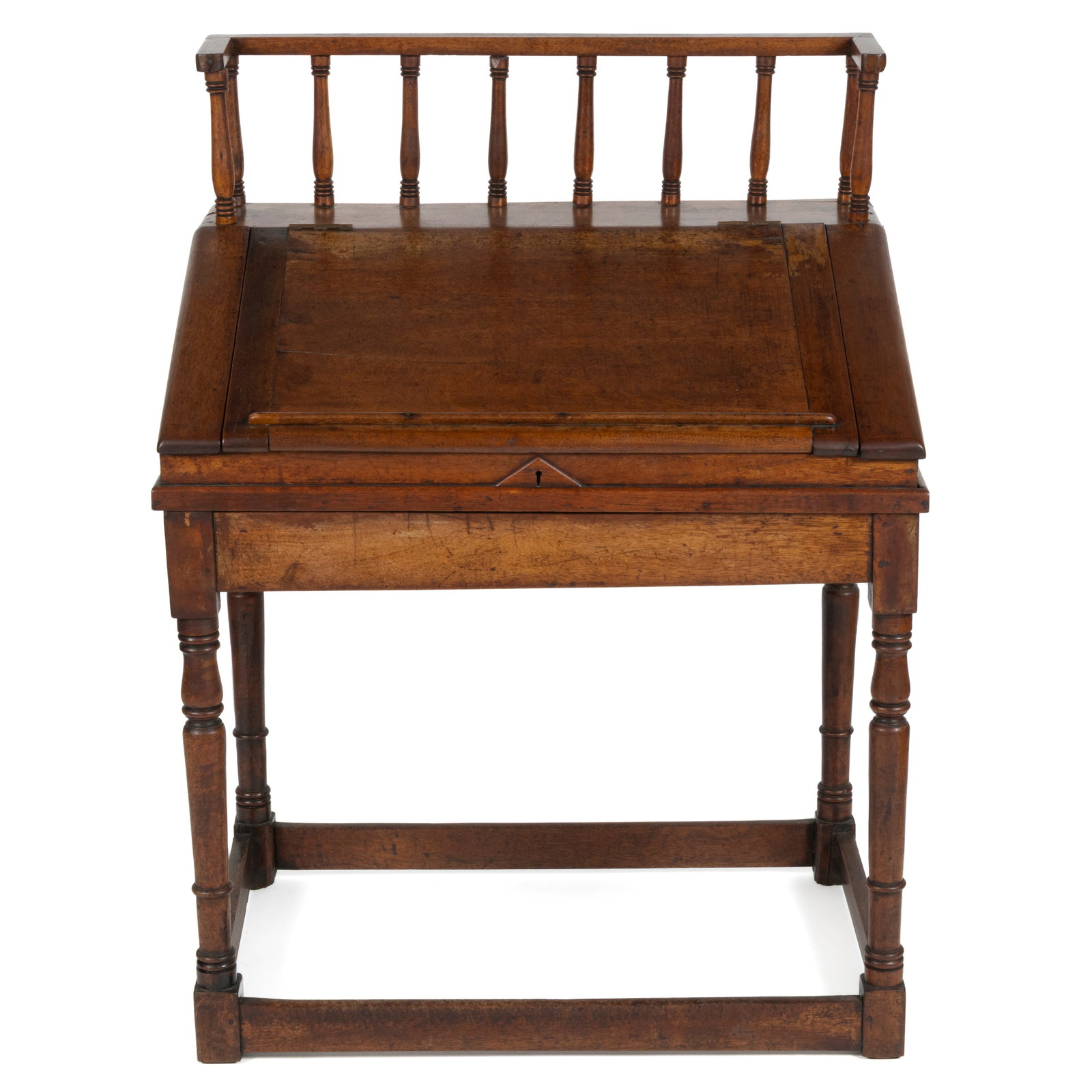 PENNSYLVANIA WALNUT DESK ON FRAME: PENNSYLVANIA WALNUT DESK ON FRAME, two-piece construction, the high gallery supported by turned spindles over a rectangular top, and a central hinged writing surface which conceals an open interior, t