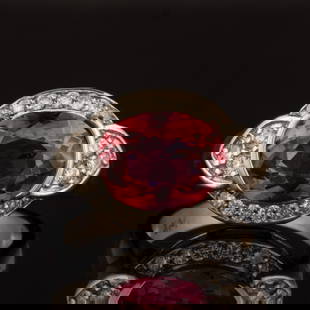 VINTAGE / CONTEMPORARY 14K WHITE GOLD, PINK TOURMALINE, AND DIAMOND LADY'S RING: VINTAGE / CONTEMPORARY 14K WHITE GOLD, PINK TOURMALINE, AND DIAMOND LADY'S RING, set with an oval-cut pink tourmaline measuring approximately 11 x 8.3 mm, surrounded by 20 round brilliant-cut mele