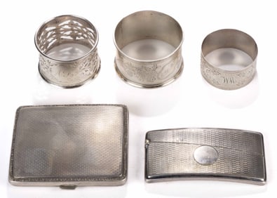 ENGLISH STERLING AND OTHER 0.800 SILVER ENGRAVED-DECORATED CASES AND NAPKIN RINGS, LOT OF FIVE