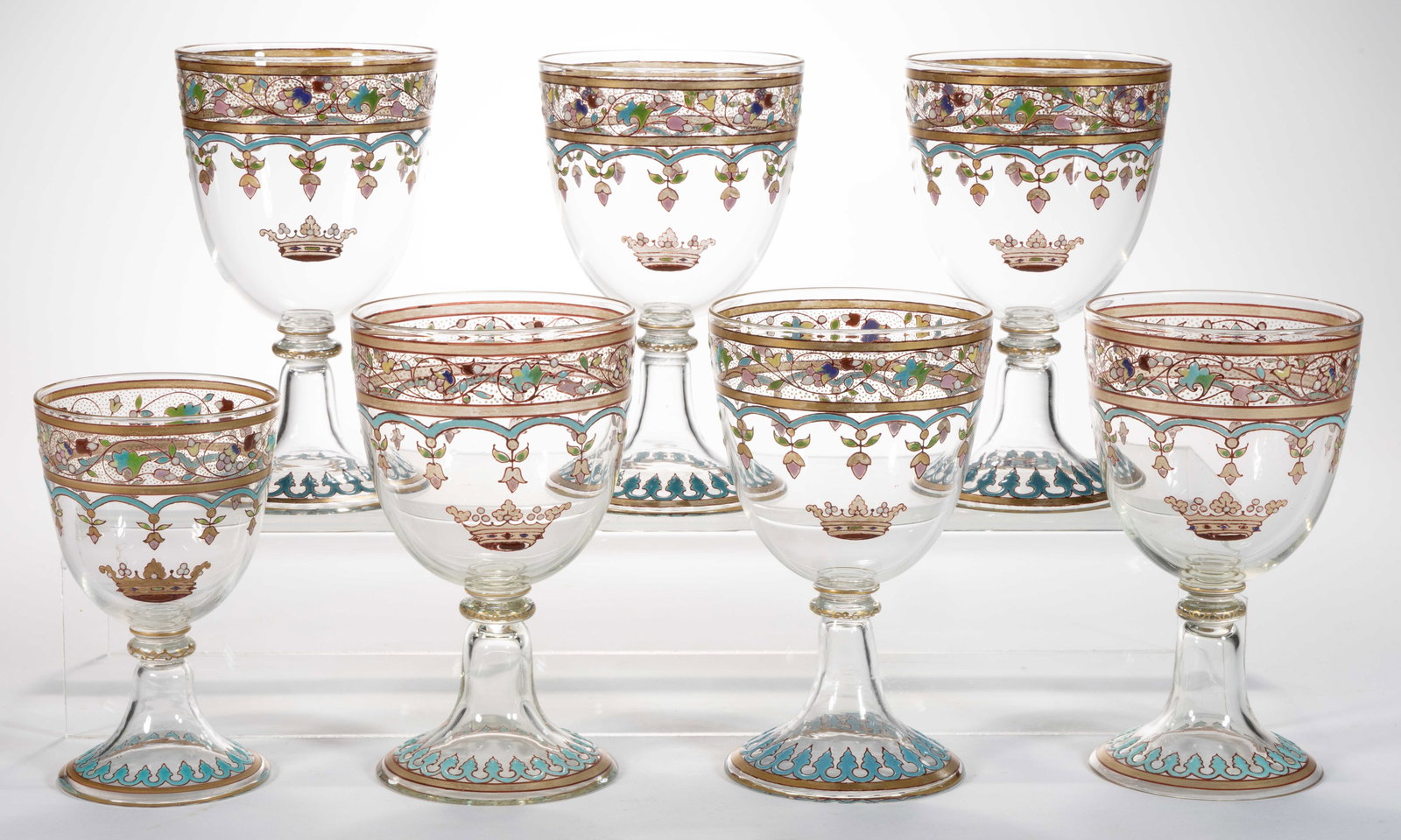 J. P. IMBERTON ENAMEL-DECORATED ART GLASS DRINKING ARTICLES, LOT OF SEVEN: J. P. IMBERTON ENAMEL-DECORATED ART GLASS DRINKING ARTICLES, LOT OF SEVEN, (updated 4/16/2025) colorless with polychrome-enamel decoration, comprising six goblets and a wine glass, each having&nb