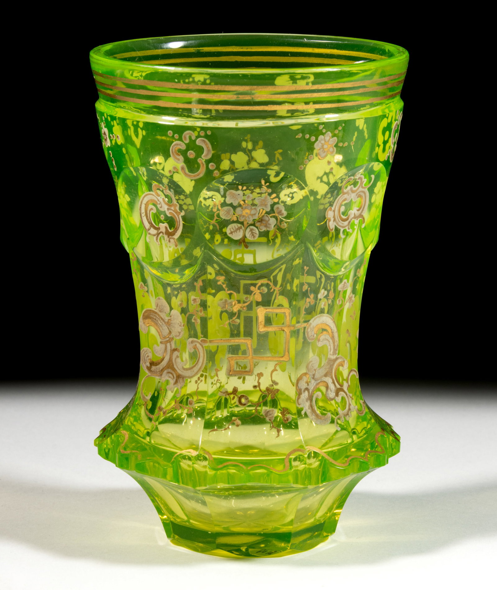 BOHEMIAN CANARY CUT PUNTY AND SWAGS GLASS BEAKER: BOHEMIAN CANARY CUT PUNTY AND SWAGS GLASS BEAKER, canary (reacts under black light), petticoat form with a lower skirt, upper band of punty cuts with lower swags, Moorish skirt edge, overall gilt