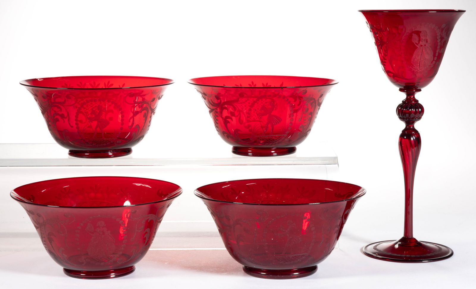 CONTINENTAL ENGRAVED RUBY GLASS ARTICLES, LOT OF FIVE: CONTINENTAL ENGRAVED RUBY GLASS ARTICLES, LOT OF FIVE, ruby, comprising a wine and four bowls, having matching engraving with a Victorian gentlemen and basket of flowers decoration. Maker unverif