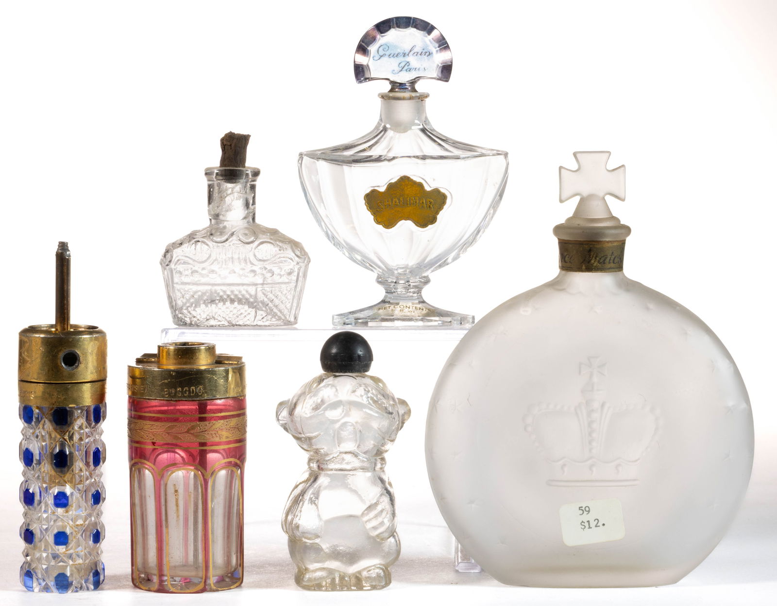 ASSORTED GLASS PERFUME BOTTLES / ATOMIZERS, LOT OF SIX: ASSORTED GLASS PERFUME BOTTLES / ATOMIZERS, LOT OF SIX, including two French cut-overlay atomizers with incomplete mechanisms and a Baccarat Guerlain "Shalimar". Fourth quarter 19th/mid 20th