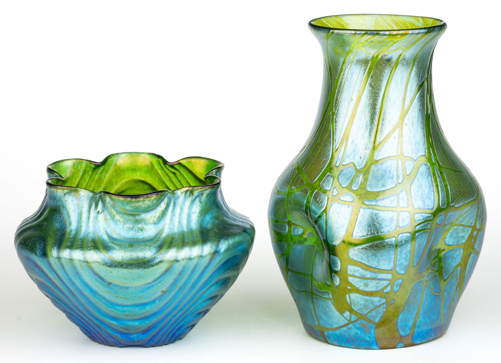 LOETZ IRIDESCENT ART GLASS VASES, LOT OF TWO: LOETZ IRIDESCENT ART GLASS VASES, LOT OF TWO, green iridescent, comprising a short urn form Wellenoptisch with a scalloped rim, and a tall dimpled Pampas, each having a polished pontil mark. Bohe