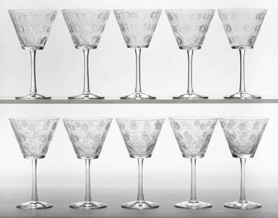 LALIQUE CRYSTAL DRINKING GLASSES / WINES, SET OF TEN: LALIQUE CRYSTAL DRINKING GLASSES / WINES, SET OF TEN, colorless, conical bucket bowls having molded recessed rosettes or snowflakes with frosted interiors arranged in rows amongst a backdrop