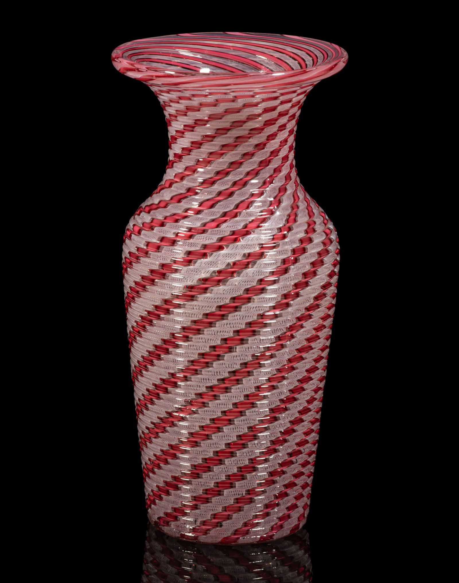 FRENCH REEDED AND SWIRLED ART GLASS PITCHER: FRENCH REEDED AND SWIRLED ART GLASS PITCHER, urn form with red opaque swirls alternating with opal filigree swirls, polished pontil mark. Probably Compagnie des Cristalleries de Saint Louis. Seco