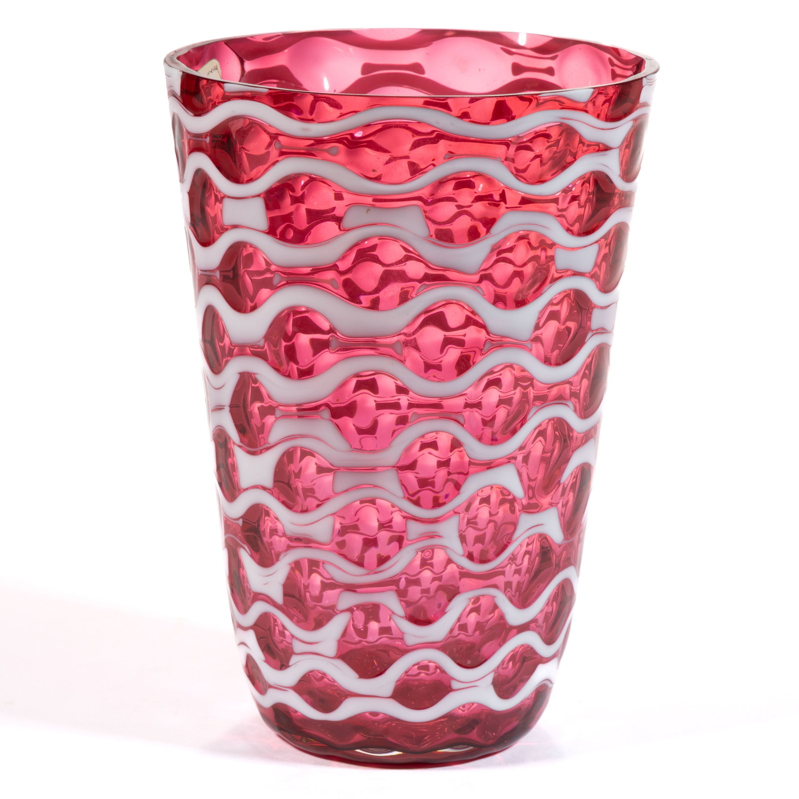 UNIDENTIFIED BLOWN EYES ART GLASS VASE: UNIDENTIFIED BLOWN EYES ART GLASS VASE, cranberry, slightly conical form with opal eyes pattern to the exterior, polished rim. Maker unverified. 20th century. 7" H. Provenance: The estate c