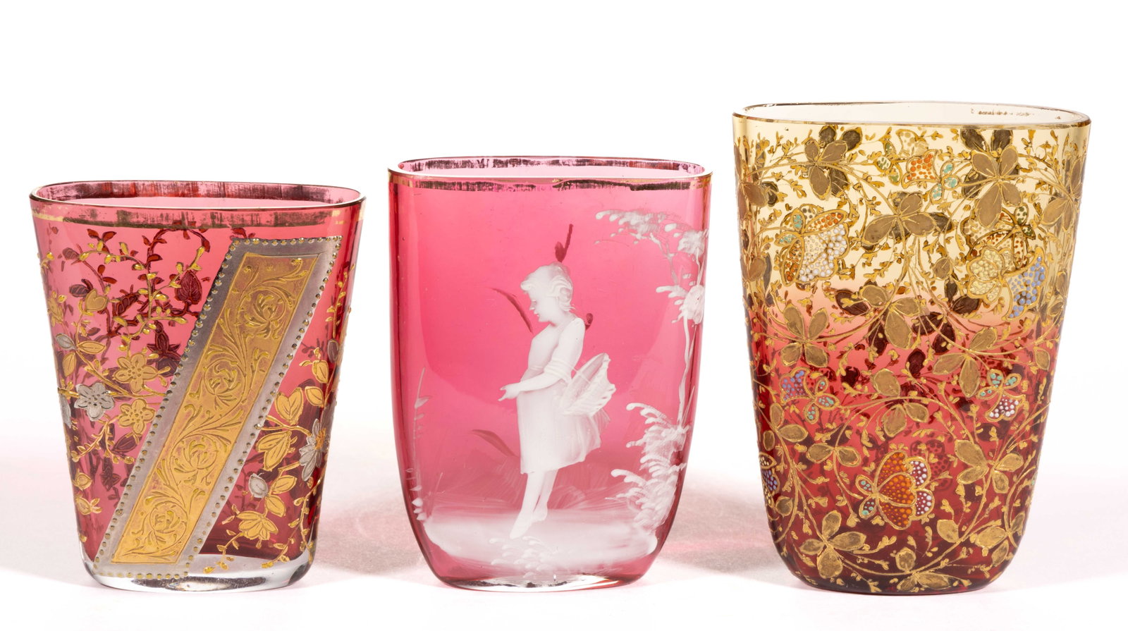 VICTORIAN ENAMEL-DECORATED HANGING VASES, LOT OF THREE: VICTORIAN ENAMEL-DECORATED HANGING VASES, LOT OF THREE, comprising a rubina example with stylized floral decoration, a cased cranberry with floral and ribbon decoration, and a Mary Gregory (so-called)